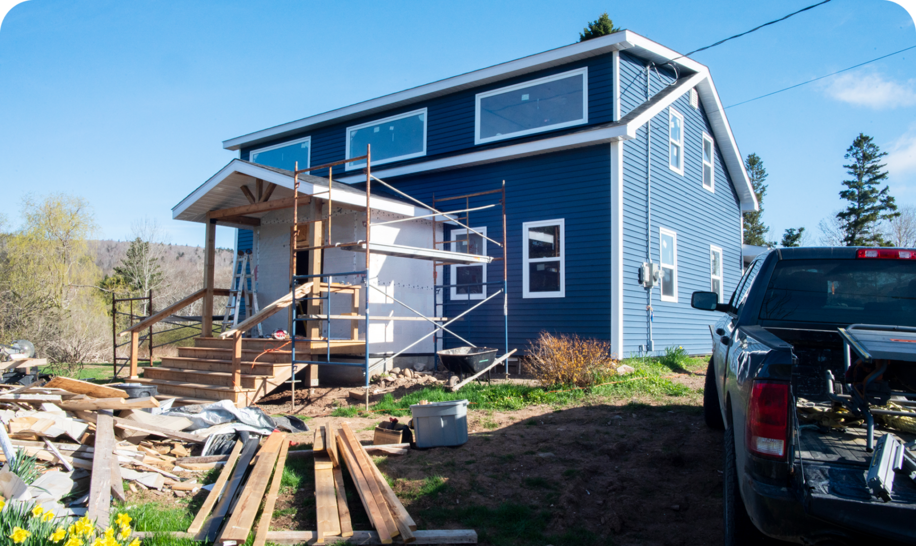 Construction materials outside blue house