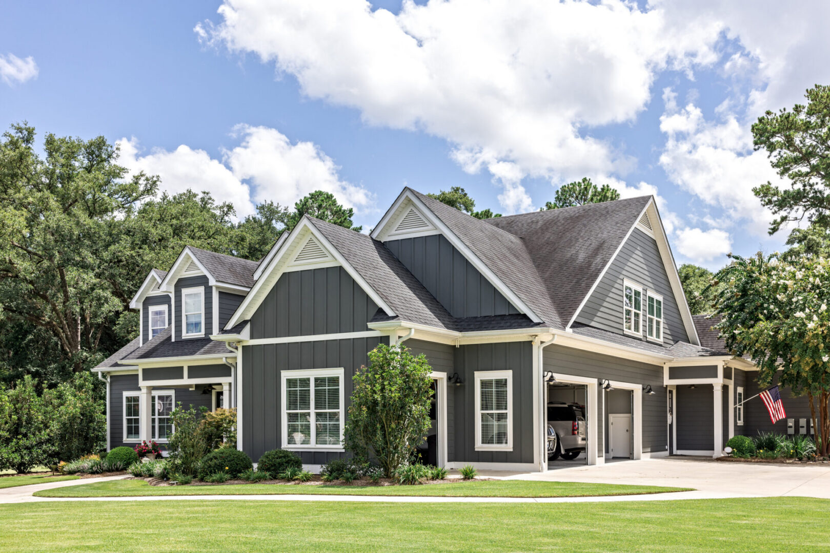 Modern gray house with lush garden